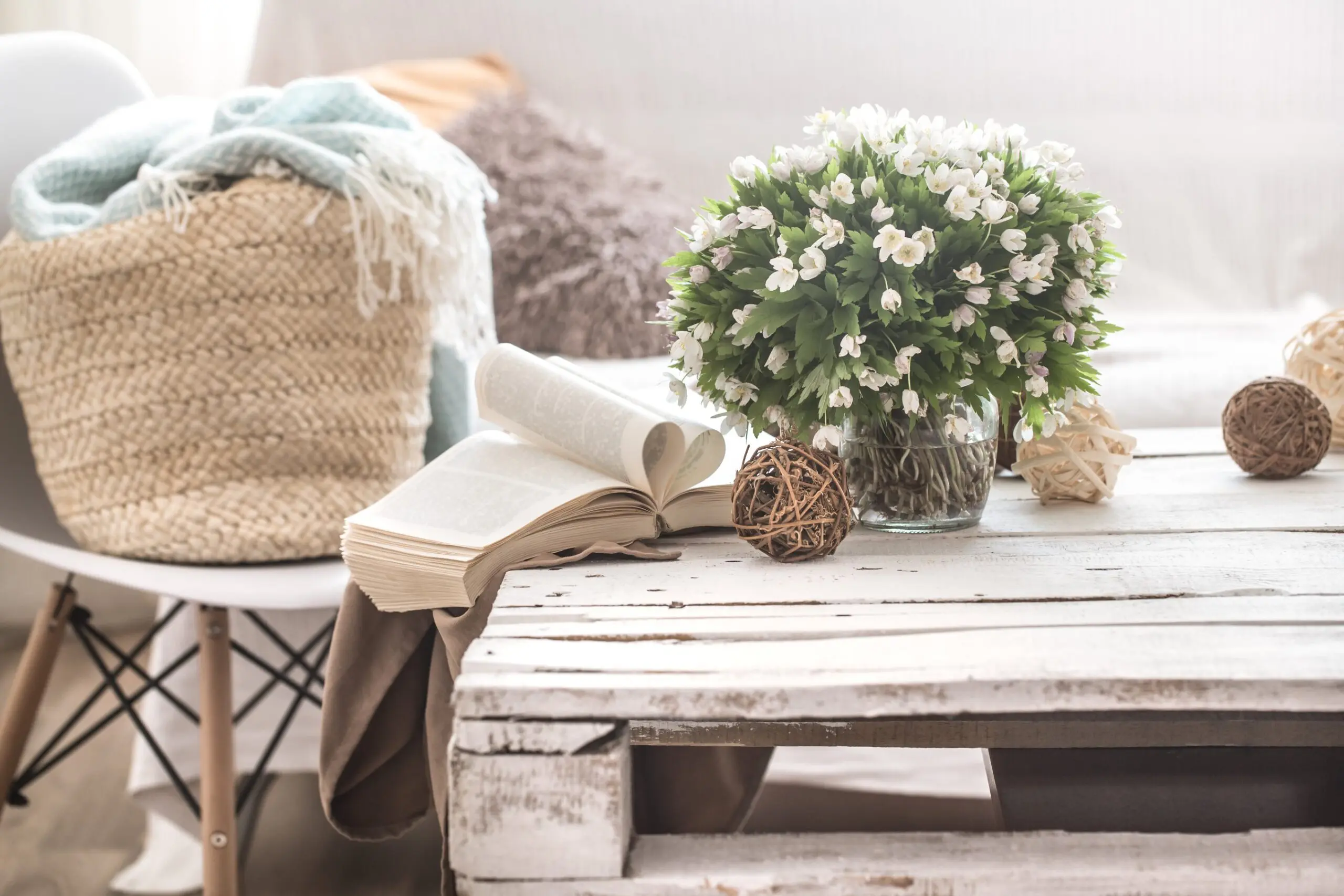 Cozy living room with flowers and books.