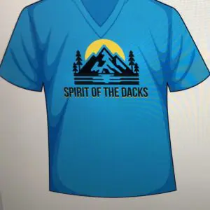 Blue t-shirt with mountain and lake graphic, text 'Spirit of the Dakotas'.