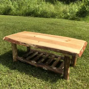 Rustic wooden bench with a natural wood finish and sturdy legs.